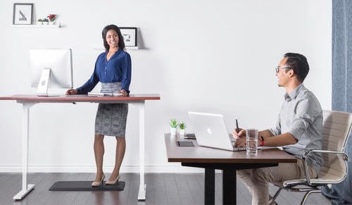 Designer working at a height-adjustable standing desk, demonstrating flexibility and comfort